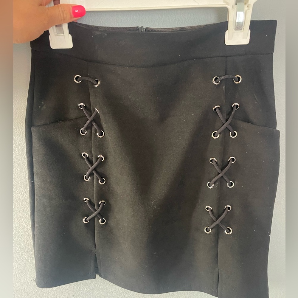 Black mini skirt with criss cross stitching
